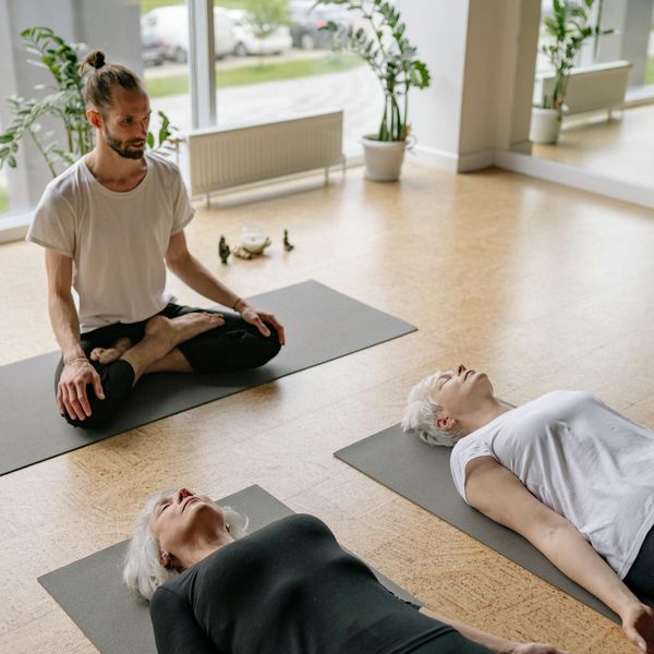 A serene studio space with yoga mats ready for a class.